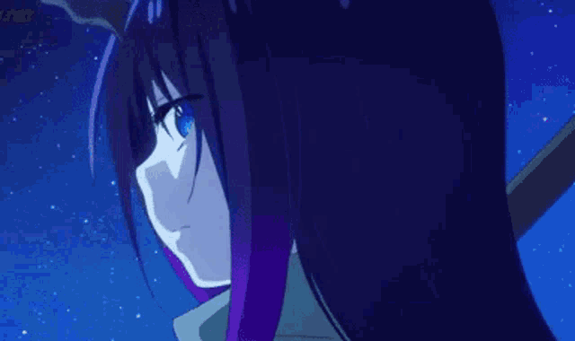 a close up of a girl with purple hair and blue eyes looking at the camera .