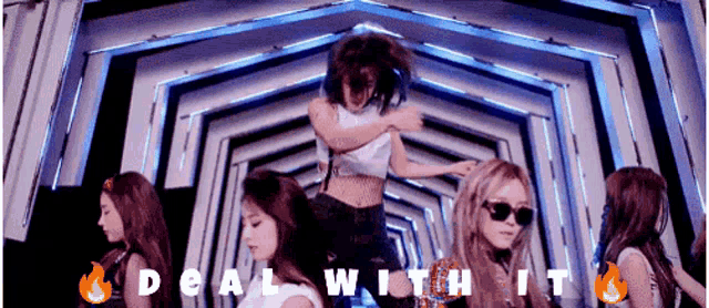 a group of girls are dancing in a tunnel and the words deal with it are on the bottom