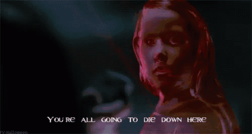 a woman in a dark room with the words " you 're all going to die down here "