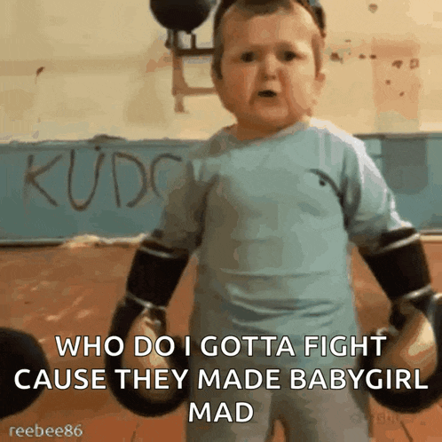 a baby is wearing boxing gloves and says " who do i gotta fight cause they made babygirl mad "
