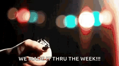 a person is holding a watch with the words we made it thru the week written on it