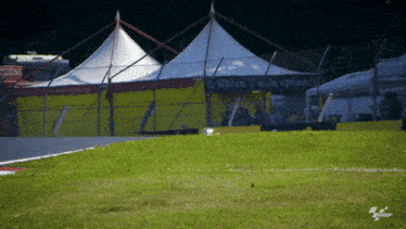 a yellow and white tent with a sign that says birra sulla spina