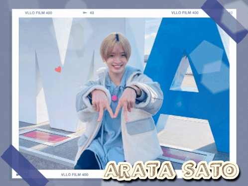 a photo of arata sato with a large blue letter a in the background