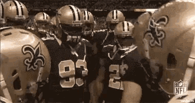 a group of new orleans saints players are huddled together