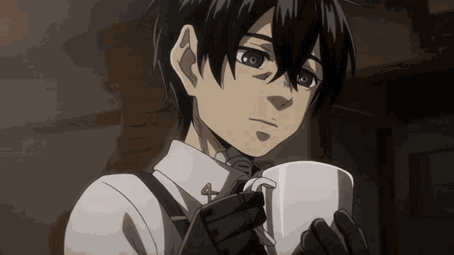 a young boy with black hair is holding a white mug