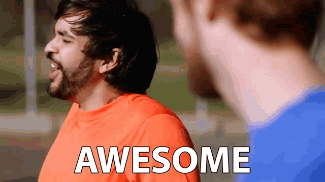 a man in an orange shirt says awesome while standing next to another man in a blue shirt