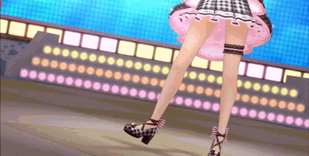 a girl in a pink dress and black and white shoes is dancing on a stage .