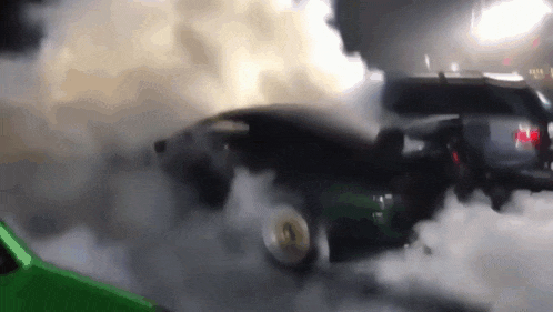 a green car is burning rubber and smoke is coming out of it 's tires .