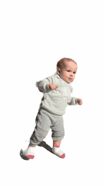 a baby wearing a green hoodie that says sky valley on it