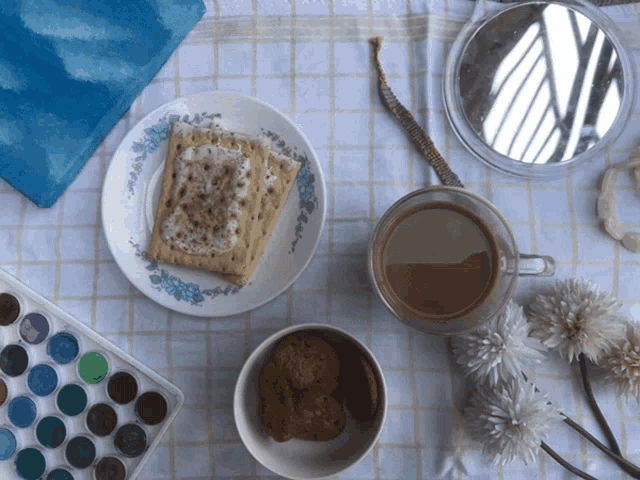 a plate with a toaster pastry and a cup of coffee