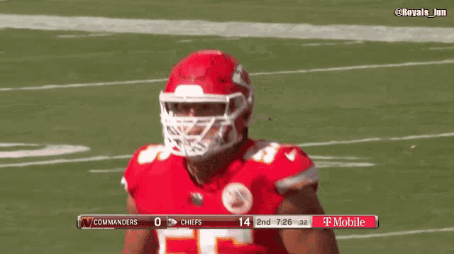 a football player in a red uniform with the number 55 on it