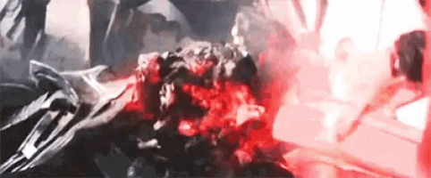 a close up of a person 's head with blood coming out of it in a dark room .