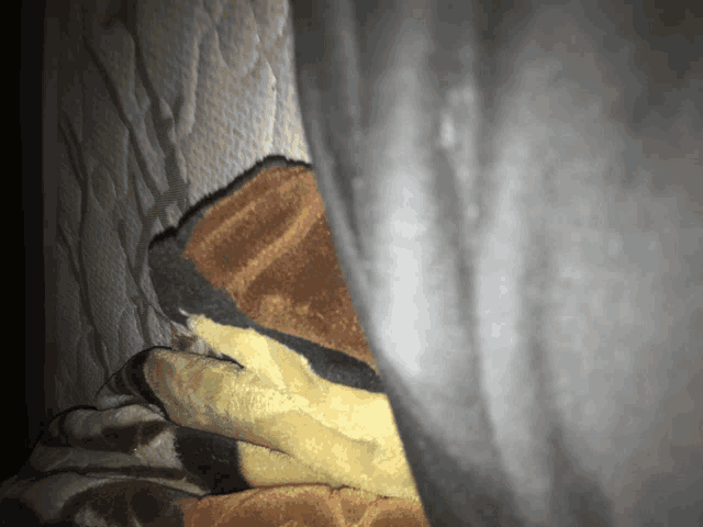 a close up of a blanket on a mattress