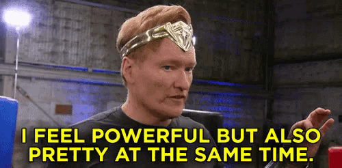 a man is wearing a wonder woman headband and says `` i feel powerful but also pretty at the same time '' .