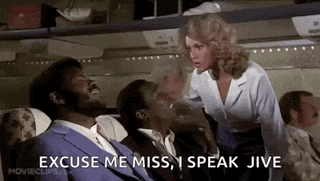 a woman is standing next to a man on a plane .