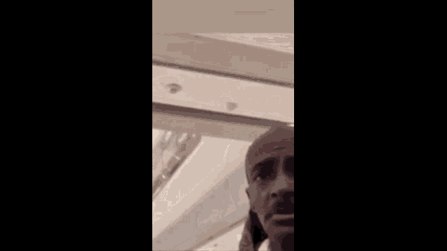 a man with a mustache is looking at the camera with a caption that says ' uuu iska buuka ' on it