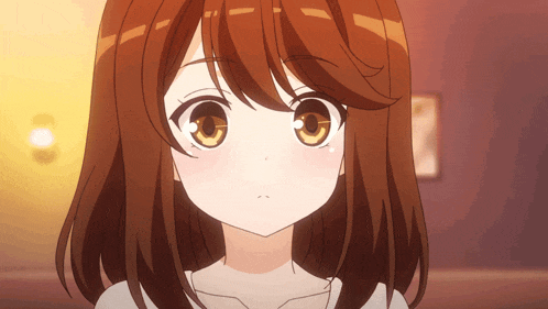 a close up of a girl with brown hair