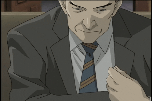 a man in a suit and tie is looking down at something