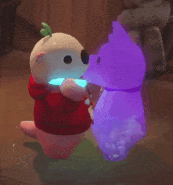 a stuffed animal with a red hoodie is holding a light stick