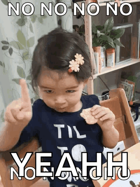 a little girl giving a thumbs up with the words no no no no yeah behind her