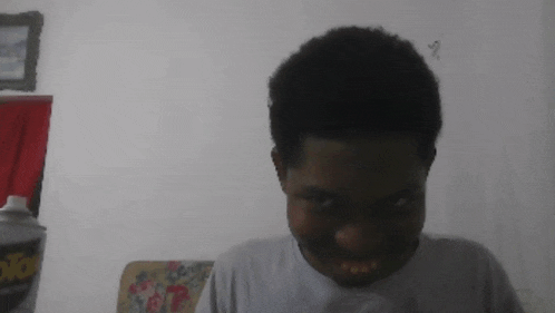 a person making a funny face in front of a can of ant spray