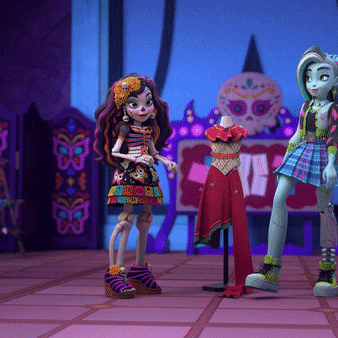 two monster high dolls stand next to a mannequin