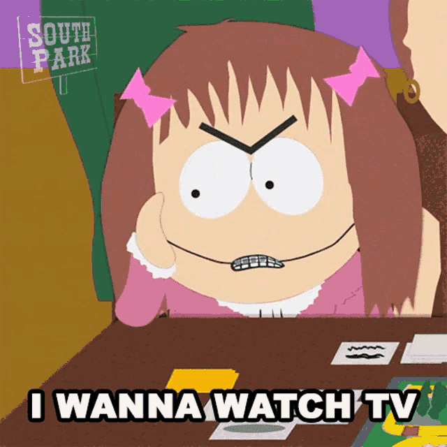 a cartoon girl from south park is sitting at a table