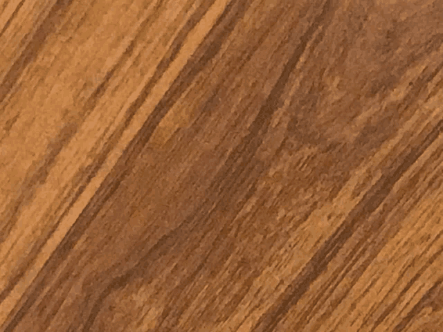 a close up of a piece of wood with a diagonal stripe