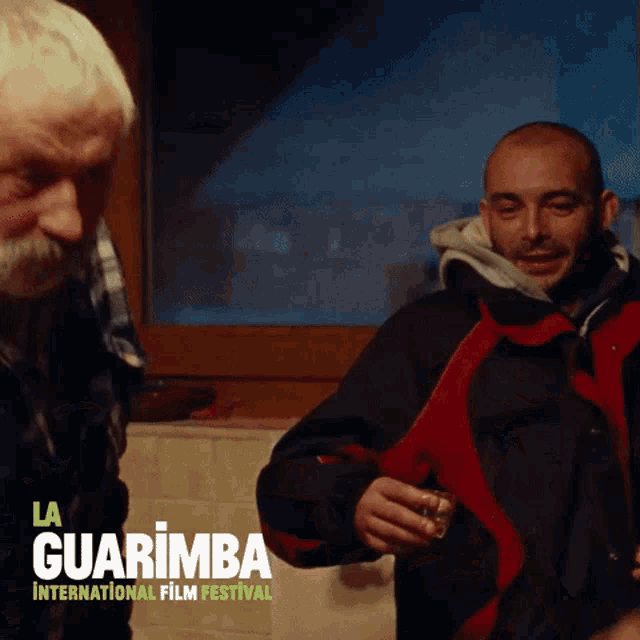 a poster for la guarimba international film festival with two men