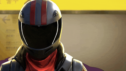 a close up of a person wearing a helmet with a red stripe