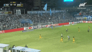 a soccer game is being played with the score 0-0