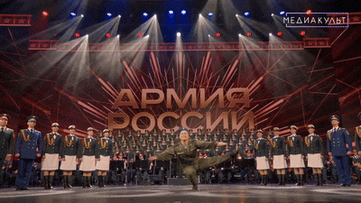 a man in a military uniform stands on a stage in front of a sign that says " army "