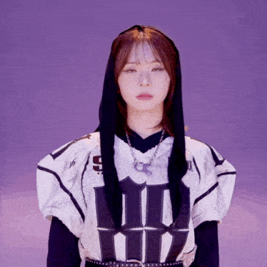 a girl wearing a black hooded top with the number 45 on it