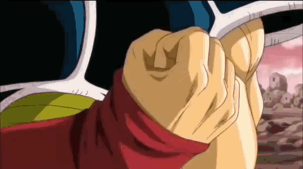 a close up of a person 's fist with a red sleeve