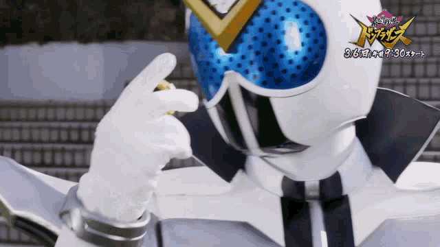 a person in a white costume with a blue helmet and a sign that says ' samurai '