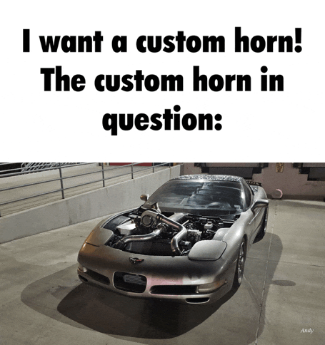 a car with the hood open and the words " i want a custom horn " on top