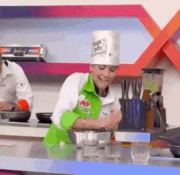 a woman wearing a chef 's hat that says ' aoi chef ' on it