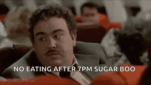 a man in a suit and tie is sitting on a plane .