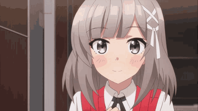 a girl with gray hair is wearing a red vest