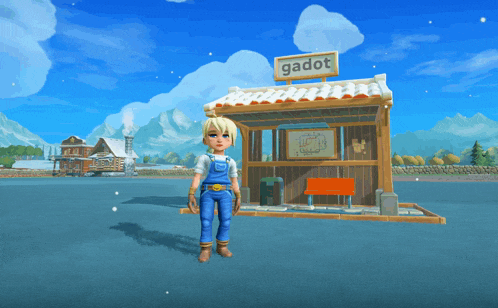 a girl stands in front of a building that says gadot on it