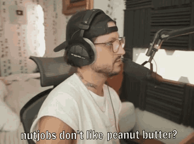 a man wearing headphones and a hat says nujobs don 't like peanut butter