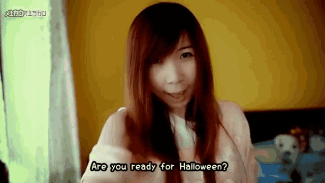a girl says " are you ready for halloween " in a video