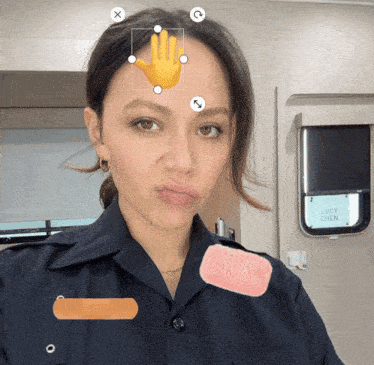 a woman in a police uniform has a hand on her forehead