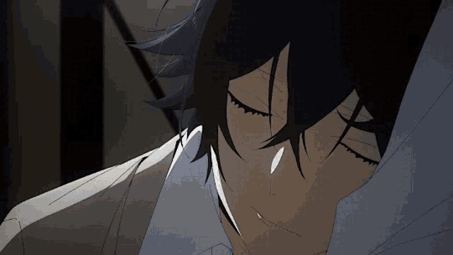 a close up of a person sleeping with his eyes closed