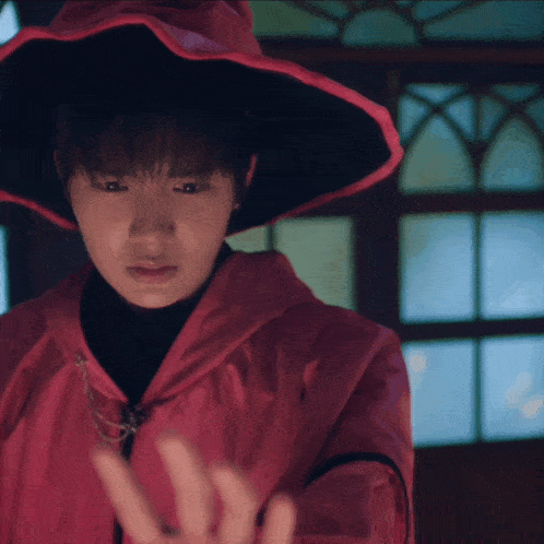 a woman wearing a red jacket and a red hat