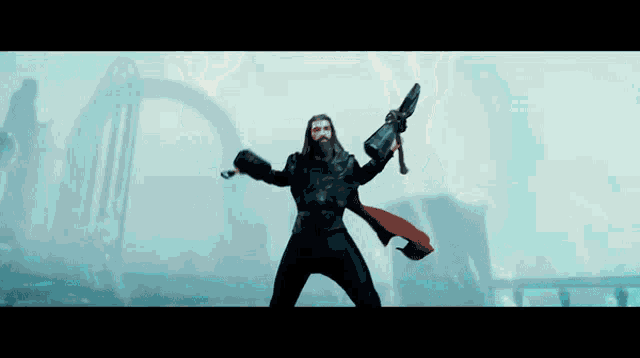 a man with a beard is holding a sword in his hand