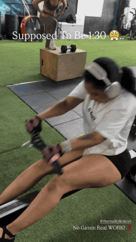 a woman wearing headphones is doing exercises in a gym with a caption that says supposed to be 1:30