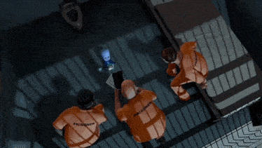 a group of men in orange shirts are looking at a cartoon character