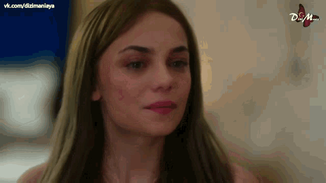 a close up of a woman 's face with the words dizimania on the bottom left