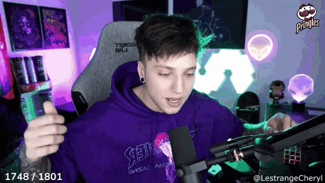 a man in a purple hoodie with the number 1748/1801